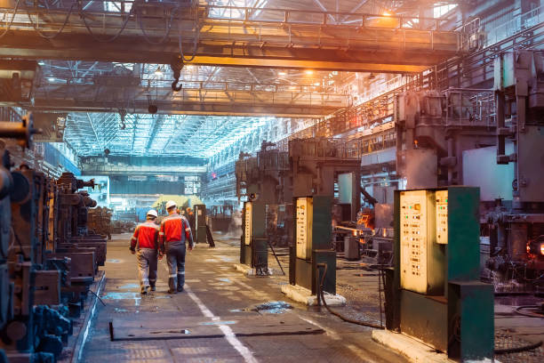 istock Workers in the steel mill. Metallurgical industry. 1271016013