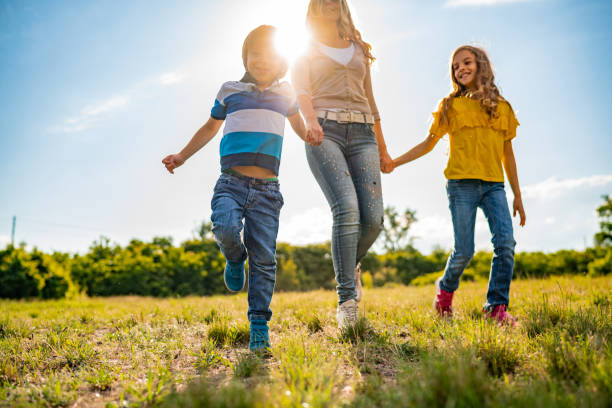 istock Family walking together in public park 1271017879