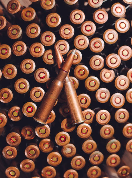 istock Bullets on a wooden background. Military concept. 1271018764