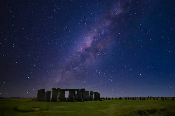 Stonehenge at night with starry sky on winter solstice.