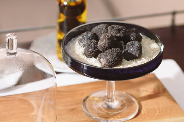 istock Black truffle mushroom on the rice on the table 1271019988