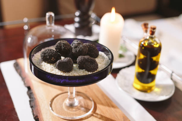 istock Black truffle mushroom on the rice on the table 1271019990