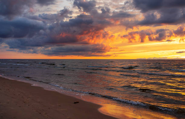 istock colorful sunset over the sea and beautiful cloudscape 1271021648