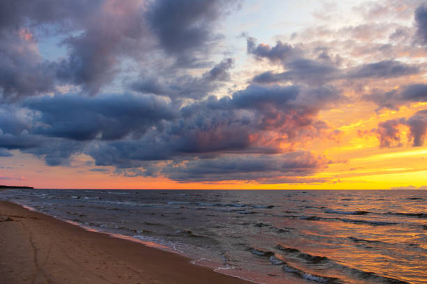 istock colorful sunset over the sea and beautiful cloudscape 1271021694