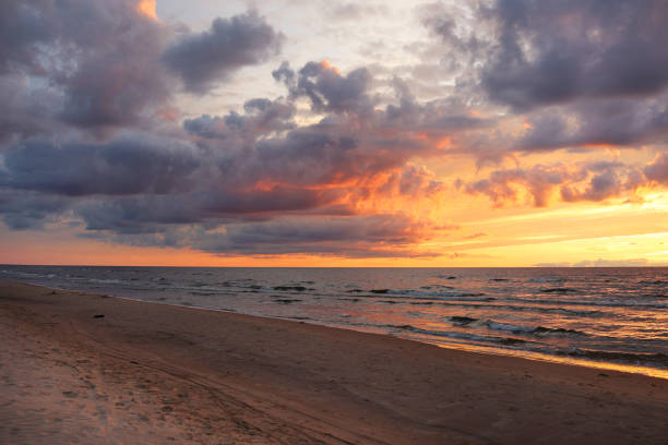 istock colorful sunset over the sea and beautiful cloudscape 1271021726