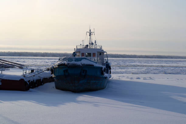 istock top view ship is waiting for spring jammed with ice of river. 1271021910
