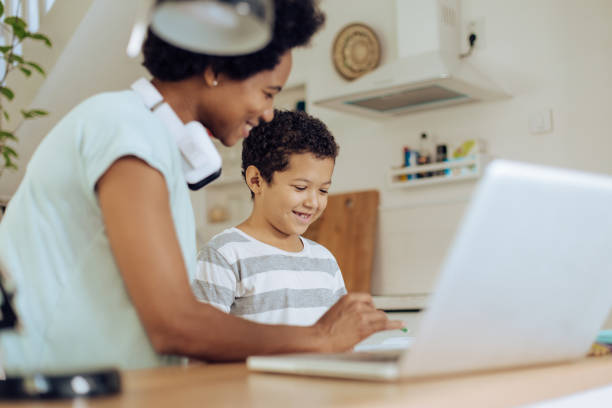 istock Mother homeschooling her son and freelancing 1271022943