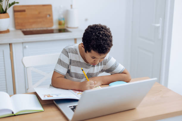 istock African-American boy learning at home 1271022979