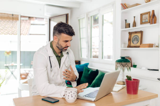 istock Doctor working online with his patients 1271023606