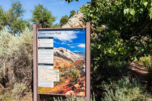 Jensen, USA - July 23, 2019: View of Desert Voices Nature Trail sign by Split Mountain Campground in summer in Dinosaur National Monument Park, Utah