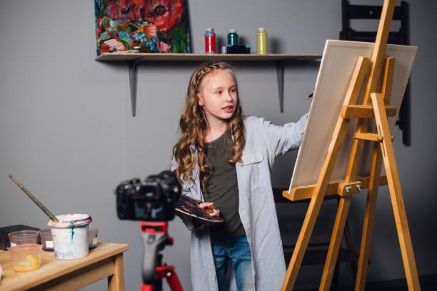 istock a young blogger girl at home leads a remote masterclass on drawing pictures during quarantine 1271023846