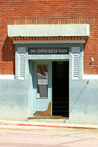 The blue painted doorway into the One Copper Queen Plaza in downtown Bisbee AZ