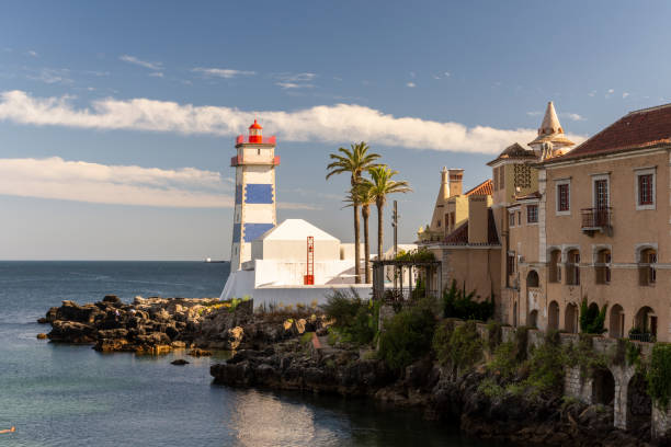 istock Beautiful view to ocean front lighthouse in Cascais 1271026610