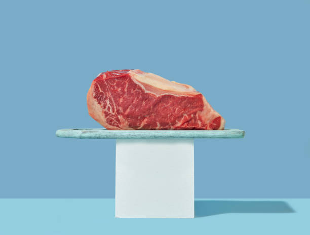 istock still life with raw steak on blue background 1271028361