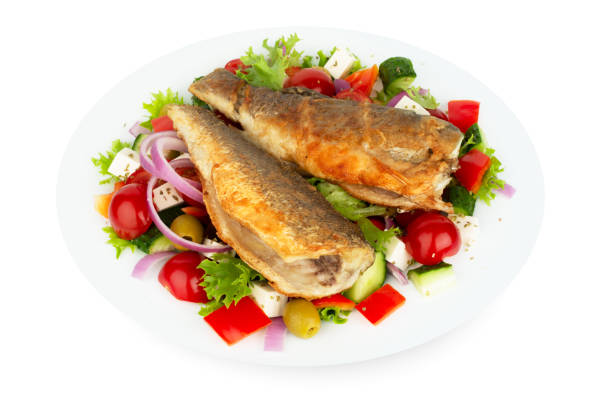 istock Baked seabass with greek salad 1271029349