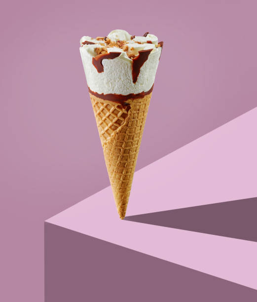 ice cream cone on purple background - frozen sweet food imagens e fotografias de stock