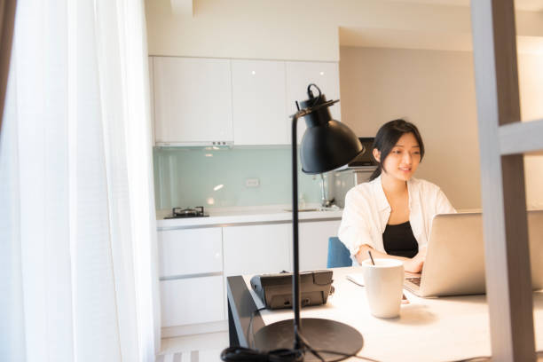 istock asian woman working at home 1271030193