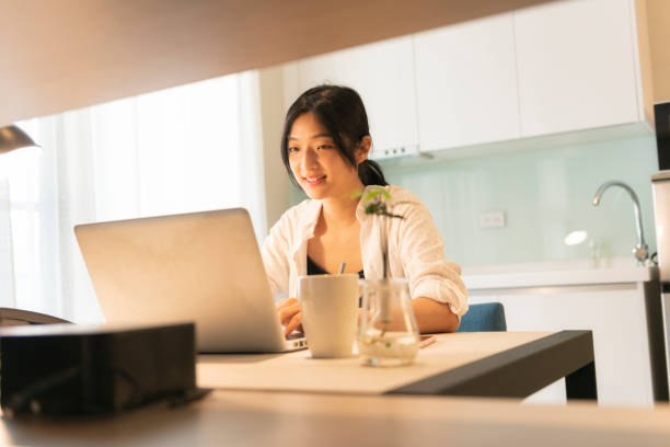 istock asian woman working at home 1271030200