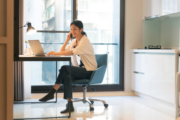 istock asian woman working at home 1271030240