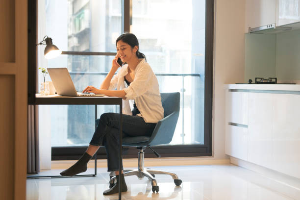 istock asian woman working at home 1271030776