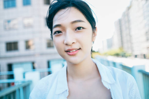 istock Asian Woman Looking At The Camera 1271030850