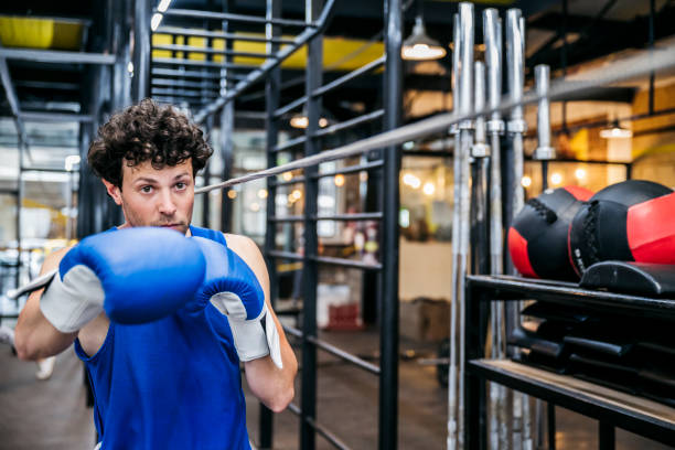 istock Hispanic male boxer practicing with slip rope in gym 1271030976
