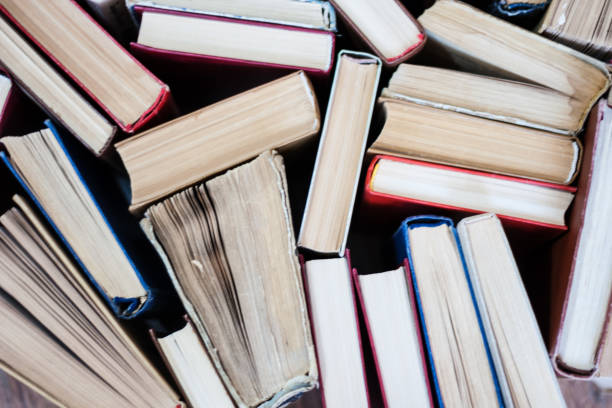 istock stack of old book, education concept background, many books piles with copy space for text 1271032200