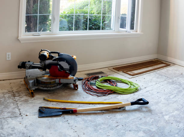 istock Stripped down floor with construction tools being prepared for new wood installation 1271035761