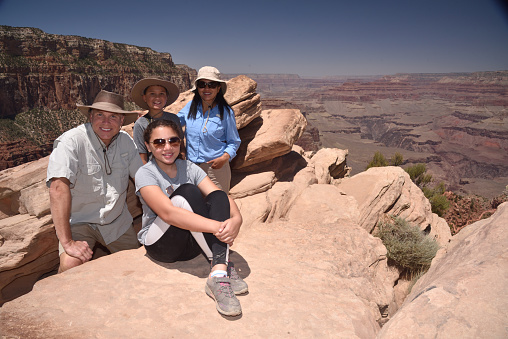 Family take a break from hiking the Grand Canyon, Arizona