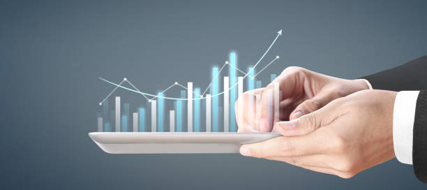 istock Plan graph growth and increase of chart positive indicators, tablet in hand 1271041593