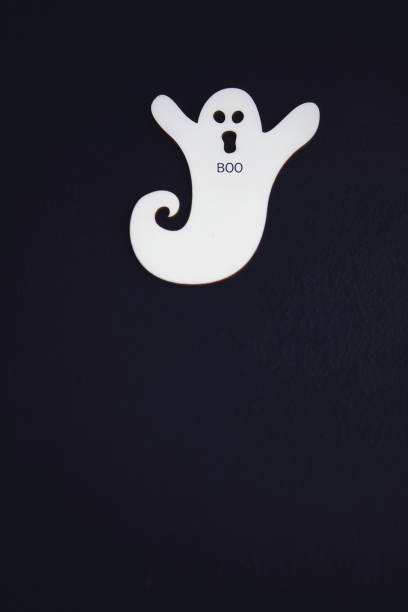 istock Purple Halloween Background with Ghost and BOO message 1271044187