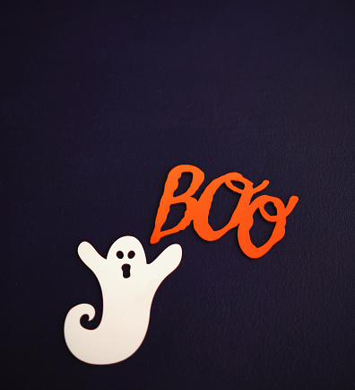 Purple Halloween Background with Ghost and BOO message