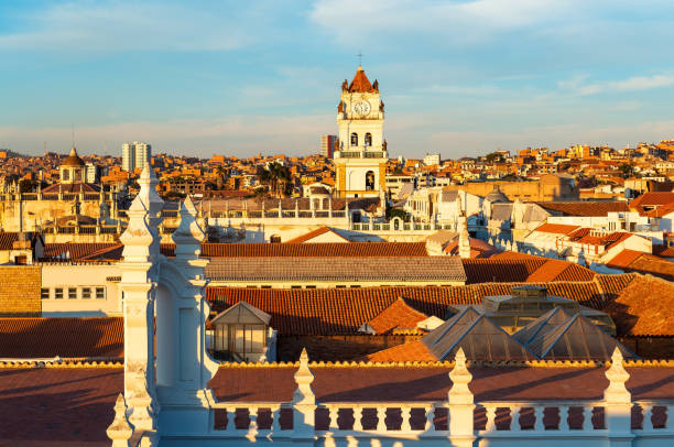 Sucre City Sunset, Bolivia Cityscape of Sucre at sunset with its colonial style rooftops and Cathedral tower, Bolivia. bolivian andes photos stock pictures, royalty-free photos & images