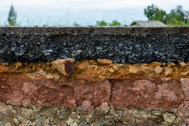 istock The layer of asphalt road with soil and rock. Un-focus image. 1271048130