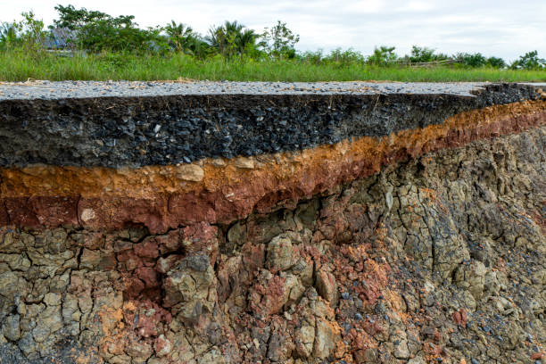 istock The layer of asphalt road with soil and rock. Un-focus image. 1271048150