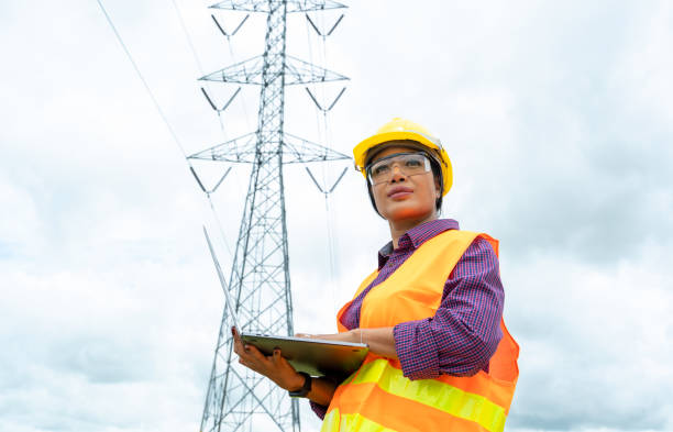 Electrical engineer women use laptop working Electrical engineer women use laptop working and checking the power grids. maintenance engineer photos stock pictures, royalty-free photos & images