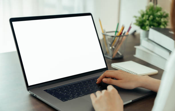 istock Woman had using laptop white screen and stationery on the table. 1271049347