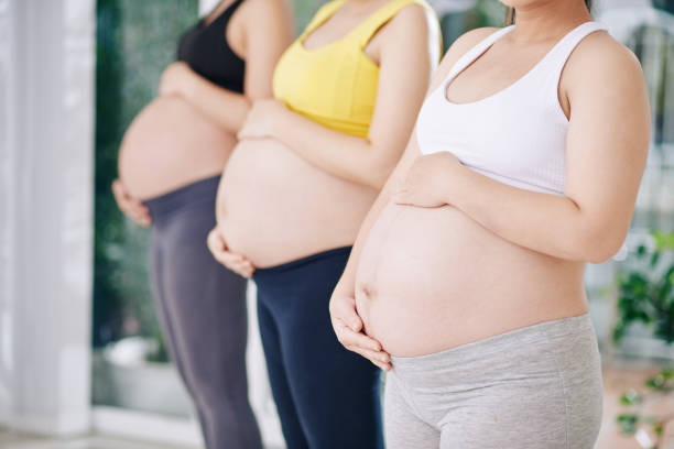 istock Pregnant women standing in row 1271050069