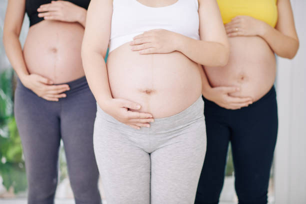 istock Pregnant women touching bellies 1271050071