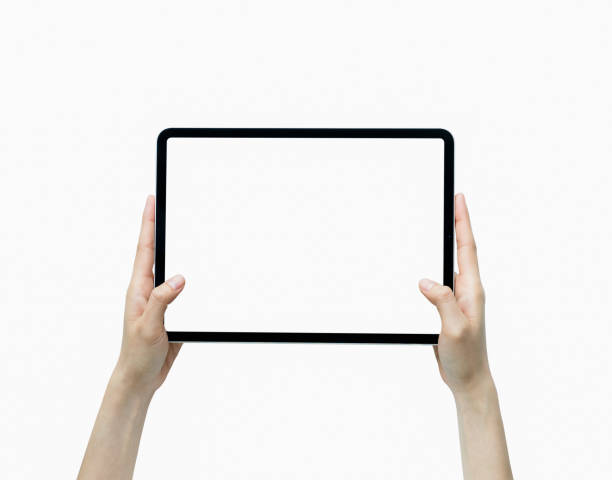istock Close-up of hand holding black tablet isolated on white background. 1271052636
