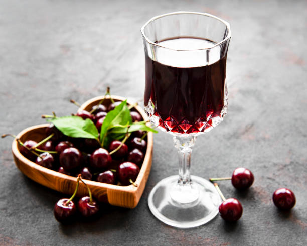 istock Cherry liqueur in a glass and fresh fruits 1271054062