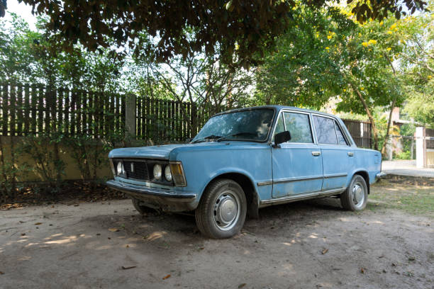 istock The old, abandoned blue car in a garden 1271062015