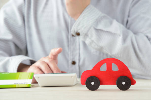 istock Person thinking about cost for car 1271065838