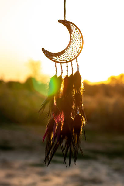istock Handmade dream catcher with feathers threads and beads rope hanging 1271067230