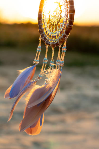 istock Handmade dream catcher with feathers threads and beads rope hanging 1271067246
