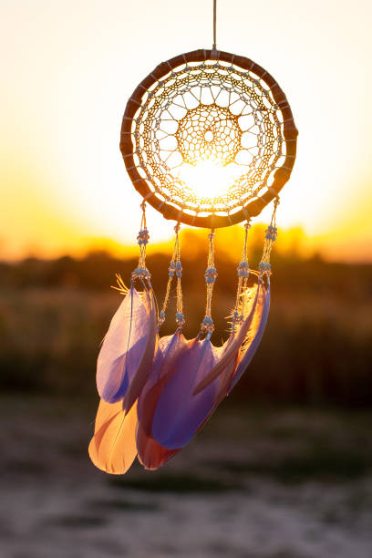 istock Handmade dream catcher with feathers threads and beads rope hanging 1271067252