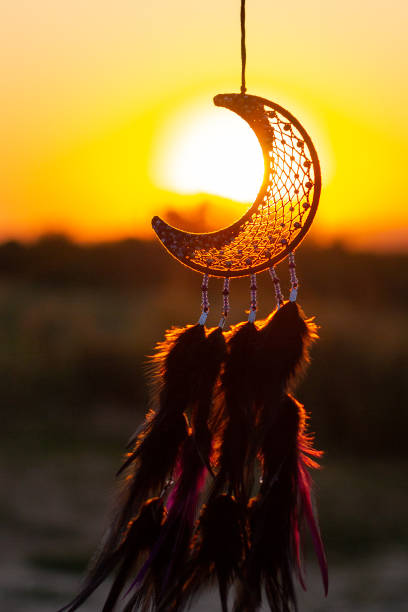 istock Handmade dream catcher with feathers threads and beads rope hanging 1271067273