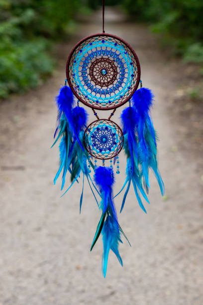 istock Handmade dream catcher with feathers threads and beads rope hanging 1271067276