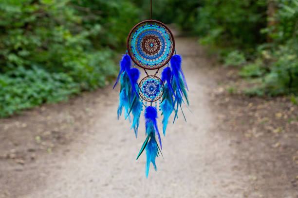 istock Handmade dream catcher with feathers threads and beads rope hanging 1271067284