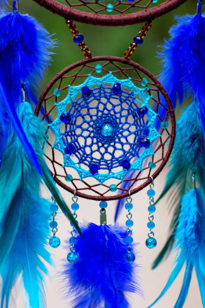 istock Handmade dream catcher with feathers threads and beads rope hanging 1271067289